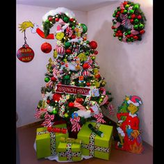 a christmas tree with presents under it