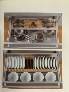 two open drawers with dishes and utensils in them