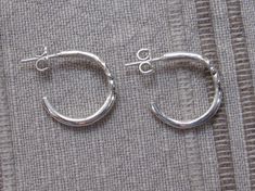 ER664 - Sterling Silver Handmade One of a Kind Post Hoop Earrings. Nice Casual everyday earrings and would make a great gift. Earrings measure: 2 mm Wide x 18mm Outside Diameter These earrings are made using the Lost Wax Casting Process where I make the design in wax and then cast it into Silver. To learn more about the Lost Wax process and me please visit my website at: www.denimanddiamondjewelry.com Modern Handmade Hoop Earrings For Anniversary, Handmade Modern Hoop Earrings For Anniversary, Classic Handmade Hoop Earrings For Anniversary, Handmade Classic Hoop Earrings For Anniversary, Swiss Blue Topaz Ring, Artisan Earrings, Wax Casting, Casting Jewelry, Original Jewelry