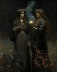 two women standing next to each other holding sparklers in their hands and looking at the sky