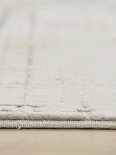 an area rug on the floor that is clean and ready to be used as a carpet