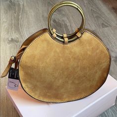 Orange Bag Trendy Gold Satchel For On-the-go, Chic Gold Satchel With Round Handle, Gold Shoulder Bag With Round Handle For Daily Use, Trendy Satchel With Round Handle For On-the-go, Gold Bag With Round Handle For Everyday Use, Orange Bag, Color Orange, Saddle Bags, Crossbody Bags