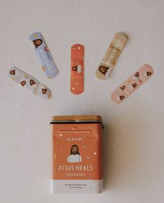 the jesus heals band aids are on display next to some other medical supplies and magnets