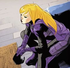 a woman in a purple suit standing next to a wall