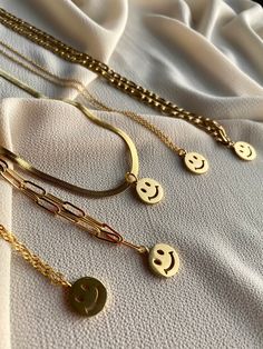 "Have a look at our shop Announcement section to avail coupon codes. https://www.etsy.com/shop/RococoLadyJewelry?ref=simple-shop-header-name&listing_id=1110983977 14k Gold Smiley Face Necklace, Gold Charm Preppy Jewelry Layering Necklaces, Happy Fun emoji Necklace, Gold Chain Necklace for Women, Jewelry ♥ Description ♥ ღ Smiley face necklace: Bring some cheer to your accessory with our cute happy face charm necklace. Features 14k gold 3 layered Snake chain necklace with a fun enamel smiley f Trendy Charm Chain Necklace As Gift, Trendy Charm Chain Necklace For Gift, Trendy Chain Necklace With Charms For Gift, Fun Jewelry With Adjustable Chain For Gifts, Fun Gold Jewelry For Gifts, Trendy Customized Gold Charm Necklaces, Trendy Round Pendant Charm Necklace As Gift, Trendy Round Pendant Charm Necklace Gift, Trendy Round Charm Necklaces For Everyday