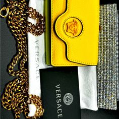 Brand New Versace Wallet Will Come With Everything Pictured! Box With Dustbag, Original Chain, & Paperwork Compact, Trifold, Tricolor Sun-Citron-& Lavender Front Fold Over Closure With Signature Medusa Plaque. Snap Closure Coin Pouch And Trifold Opening Reveals A Place For Bill And 3 Card Slots. *Hidden Pocket With Room For Keys And Small Accessories. Comes With Detachable Chain For Versatile Wear And Style. Chain Length Is Approximately 18 Inches Luxury Gold Wallet On Chain With Branded Hardware, Yellow Leather Travel Wallets, Evening Yellow Shoulder Bag With Branded Hardware, Elegant Yellow Leather Wallet, Yellow Rectangular Wallet With Removable Pouch, Luxury Yellow Clutch Shoulder Bag, Yellow Leather Rectangular Wallet, Versace Wallet, Versace Bags