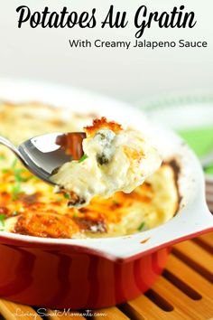 potato au gratin with creamy jalapeno sauce in a red casserole dish