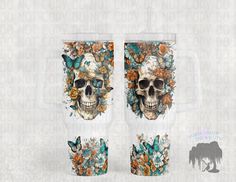 two cups with skulls and flowers on them, one has a skull in the middle