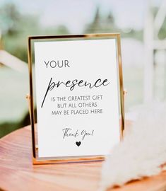 a sign that says your presence is the greatest gift but all others may be placed here