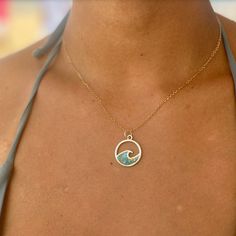 A plastic-y spin on the popular wave necklace! The Biscayne Bay Necklace elevates your style while championing sustainability. This unique piece blends ocean-inspired design and eco-consciousness. The pendant's wave shape is filled with a mosaic of upcycled microplastics. Suspended from a sterling silver chain, the necklace rests comfortably against your skin, serving as a tangible commitment to a cleaner planet. Along with looking beautiful, it's a conversation starter, a symbol of change, and Cheap Green Ocean-inspired Jewelry, Symbol Of Change, Ocean Outfits, Wave Jewelry, Ocean Inspired Jewelry, Ocean Necklace, Beach Stuff, Wave Necklace, Beach Necklaces