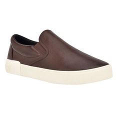 Essential and on trend, this slip-on sneaker will easily complete any look. It features a round shaped toe, a slight platform and Calvin Klein logo patch on the back counter. Founded in New York in 1968, the brand elevates everyday essentials to globally iconic status. | Calvin Klein Men's Rydor Slip-on Casual Sneakers, Brown, 10M Sneakers Brown, Calvin Klein Men, Medium Brown, Everyday Essentials, Mens Shoes Sneakers, Casual Sneakers, Sneakers Fashion, Patch Logo, Slip On Sneaker