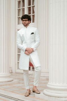 This sherwani is designed to fit seamlessly, ensuring a regal look tailored for grooms on their big day or anyone attending a grand celebration. The material is a high-grade silk blend that radiates a luxurious sheen and feels soft against the skin. The sherwani comes in various sizes to ensure a perfect fit for everyone. Available in a timeless white color, it pairs beautifully with a contrasting kurta or churidar. Top Details Color -white fabric -Designer Self-Design Print  Bottom Details Color -White Fabric - Cotton, Style -Pant Package Includes: Indo-western with pant  Turban, Mojari, And Other Accessories Are Not Sold Along With The Dress. **Important Note 1 CUSTOMIZATION - We can customize the products that are not printed. Contact us via messages if you have any queries. ----------- Ceremonial White Unstitched Suit With Dabka, Fitted Nehru Jacket With Cutdana For Groom, Fitted Chikankari Embroidery Sherwani For Groom, Fitted White Ceremonial Bandhgala, White Fitted Ceremonial Bandhgala, Fitted White Bandhgala For Ceremonial Occasions, White Fitted Bandhgala For Ceremonial Occasions, White Fitted Bandhgala For Groom, Fitted Traditional Wear With Cutdana For Groom