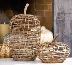 three wicker pumpkins sitting next to each other