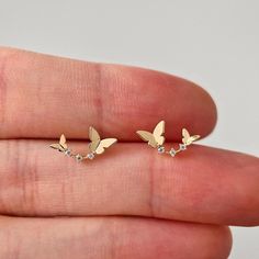 These gold dainty butterfly stud earrings are made entirely from 14K solid gold. * Each stud earring comes with silicone back, 14k gold back will be provided with an additional cost. * Jewelry is packaged and shipped in a delicate jewelry gift box. * If you are purchasing it as a gift, please feel free to add a personal note. ▷ Features  * Gold Kt: 14K solid gold * Available Gold Color: Yellow Gold * Number of Stones: 3 * Gemstone: 3A Cubic zirconia * Stone Color: Flawless D Color * Stone Cut: R Dainty Butterfly Earrings For Anniversary, Gold Earrings With Butterfly Charm For Anniversary, Butterfly Earrings Stud, Delicate Jewelry, Cz Diamond, Butterfly Earrings, Jewelry Gift Box, Jewelry Earrings Studs, Gold Color