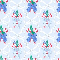 a blue and red bow with candy canes on it's side is featured in this seamless pattern