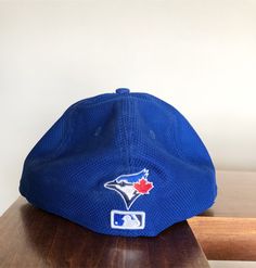 New Era Fifty Nine Fifty Toronto Blue Jays Fitted Hat size 7 1/2. This is a great looking hat that is different from the normal New Era's. It is unique, great color and awesome design. Blue Baseball Cap With Flat Brim For Fan Gear, Blue Fitted Hat For Baseball Season, Blue Curved Brim Hat For Baseball Season, Blue Flat Brim Baseball Cap For Fan Gear, Blue Visor Fitted Hat For Sports Events, Blue Fitted Baseball Cap For Baseball Season, Blue Fitted Hat For Baseball Season Fan Gear, Blue Fitted Hat With Flat Brim For Baseball Season, Blue Cap For Fan Gear