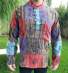 "Namaste Holiday Unisex Colorful Handmade Patchwork Nepalese Top/Kurta The unique design and color combination reflects the unique and colorful Nepalese culture. The design represents the original Nepal's symbol.  It has 3 wooden chest button, 1 front pocket. Measurements: Approximately, as it is handmade, there might be slight change in the measurements.  NEPAL SIZE IS SMALLER THAN THE USA, SO ORDERING 1 SIZE UP IS RECOMMENDED OR LOOK AT THE MEASUREMENT CHART FOR PROPER FITTING: X Small - Lengt Nepalese Culture, Eco Friendly Backpack, Patchwork Top, Flower Mound, Wooden Chest, Cotton String, Measurement Chart, Type 1, Color Combination