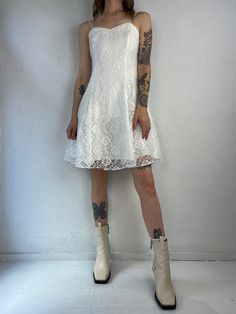 "- Vintage 90s white lace dress - Zipper up the backe - Polyester lace with acetate lining - Made in USA - Tagged 7 Bust: 16\" Waist: 13.5\" Length: 36\"" Vintage Lace Mini Dress With Lace Trim, White Summer Mini Dress With Delicate Lace, Coquette Summer Lace Mini Dress, White Lace Party Dress, Feminine White Mini Dress With Lace-up Back, Casual Off-white Lace Mini Dress, Lacy White Dress, Lace Party Dress, Lace Party Dresses