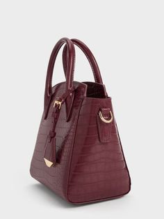 There is something undeniably alluring about a burgundy bag, especially when it comes in an evergreen silhouette like this one. A structured silhouette allows the rich hue and luxurious croc-effect finish to shine. Another thing we love about this bag is the multiple carrying options it offers: carry it by the top handles or simply attach the adjustable shoulder strap, so you can wear it at the drop length you prefer. Minimalist Exterior, Tan Outfit, Burgundy Purse, Burgundy Bag, Structured Top, Brand Collaboration, Size Chart For Kids, Charles Keith, Printables Kids