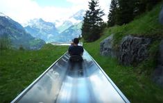 a man is riding down an empty roller coaster