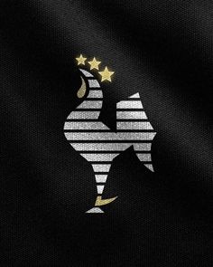 a black background with gold stars and a white rooster on the left side of it