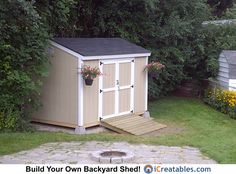 a backyard shed with steps leading to it