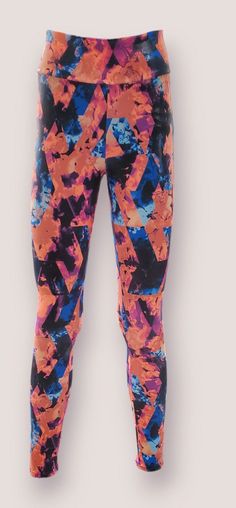 a woman's leggings with colorful paint splattered on it