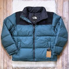 New With Tags- The North Face Men’s Eco Nuptse Jacket In Mallard Blue/ Aviator Navy With Stowable Hood, Front Zip Closure, Zippered Hand Pockets, Interior Zippered Pocket, Hem Cinch Cord And 600 Down Insulation. Relaxed Fit. Blue Puffer Jacket For Fall Outdoor Activities, Blue Functional Puffer Jacket For Outdoor Activities, Blue Nylon Outerwear For Winter Sports, Blue Functional Puffer Jacket For Fall, The North Face Puffer Jacket With Pockets For Outdoor, Functional Blue Puffer Jacket For Fall, Blue Down Outerwear For Outdoor, Blue Puffer Outerwear For Outdoor Activities, Blue Outerwear With Pockets For Winter Sports