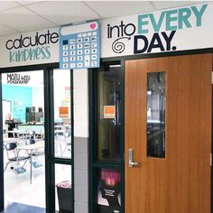 the inside of a building with two doors and signs on it that say, chocolate kindness