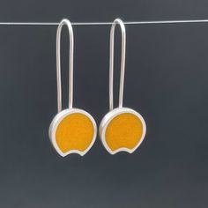 YELLOW crescent earrings... with a modern | retro pop art feel ... sterling silver dangle earrings ... fun, fresh and just a bit mod ....  handmade earrings... sawn, shaped, soldered, sanded, cast, and filled with resin ... sanded again and polished ... ..hand fabricated and colored with ground glass and resin the earrings measure 5/8" wide and  hang 1 1/2" from the curve of the ear wire. ...the perfect gift for someone special... or yourself.  shipped in a gift box. @metalobjects Retro Yellow Dangle Jewelry, Retro Sterling Silver Jewelry Gift, Retro Sterling Silver Jewelry For Gift, Minimalist Yellow Sterling Silver Jewelry, Nickel-free Yellow Jewelry For Everyday, Modern Cadmium-free Earrings As A Gift, Modern Yellow Jewelry For Gifts, Modern Yellow Jewelry For Gift, Modern Yellow Dangle Earrings