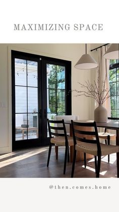 the dining room table is surrounded by chairs and windows with sliding glass doors leading outside