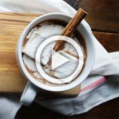 a cup of hot chocolate with marshmallows and cinnamon