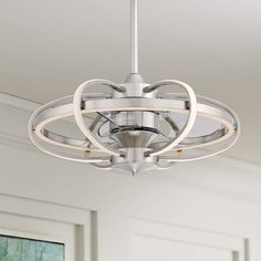 a white light fixture hanging from the ceiling