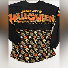 a black shirt with halloween designs on it