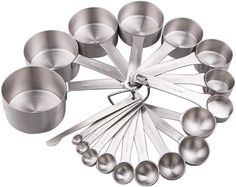 stainless steel measuring cups and spoons arranged in a circle