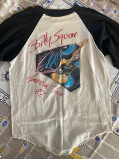 1980s Billy Squire Original 1982 Concert Emotions Tour Pop Rock Band Tee Shirt Size On Tag: Large Modern Size: L Measurements in inches, laid flat: (Double for circumference) Pit to Pit 18 Waist 17.5 Hip/bottom edge 17.5 Length 22 Length shoulder to bottom Shoulder seam to shoulder seam   50% Cotton 50% Poly  Single stitch All vintage items have been given estimated ages based on quality, materials, design and features of the pieces. These are estimates and not exact.  All items are in wearable vintage condition, unless otherwise stated. We do our best to show any major issues like rips or discoloration in photos of the item.  Measurements are taken by hand. Billy Squire, Vintage Rock Tees, Rock Band Shirts, Band Tee Shirts, Rock Band Tees, Vintage Band Tees, Pop Rock Bands, Band Shirt, Rock T Shirts