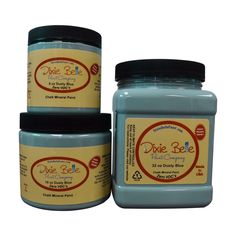 three jars of dixie ble blue colored paste sitting next to each other on a white background