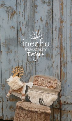 a cake sitting on top of a piece of wood next to a tree stump with the words inebha written above it