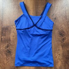 New With Tags Womens Tennis Tank Top Size Small Drifit Built In Bra Mesh Panels Blue With White Swoosh Polyester/Spandex Material Measurements Are Approximate: 14 1/2” Pit To Pit Laying Flat 23”L Shoulder To Bottom Of Hem Pet & Smoke Free Home Blue Tank Top With Built-in Bra For Yoga, Blue Stretch Tank Top For Yoga, Stretch Blue Tank Top For Yoga, Blue V-neck Athleisure Top, Blue Stretch Sporty Tank Top, Blue Sporty Stretch Tank Top, Blue V-neck Yoga Top, Fitted Blue Tank Top For Yoga, Blue V-neck Top For Yoga