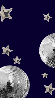 silver disco balls and stars against a dark blue background