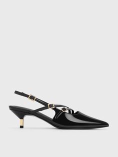 These pumps will catch the light at every angle. Featuring a high-shine black patent texture and metallic finish on the heels, this pair is understated yet impossible-to-miss at the same time. Slight tweaks to the classic slingback silhouette, like the double buckled straps across the vamps, create a contemporary aesthetic. To maximise the leg-lengthening effect, the pointed-toed style is complemented by kitten heels to give a flattering and comfortable lift to your frame. Chic Shiny Heels For Formal Occasions, Black Patent Leather Slingback Kitten Heels, Sleek High Heel Slingback Pumps With Glossy Finish, Evening Slingback Pumps With Glossy Finish, Modern Glossy Slingback Pumps For Party, Shiny Black Patent Leather Heels For Evening, Shiny Black Patent Leather Evening Heels, Evening Glossy Slingback Pumps, Shiny Black Pointed Toe Heels For Formal Occasions