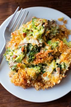 a close up of a plate of food with broccoli and cheese on it