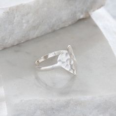 A sterling silver ring inspired by our hammered heart pendant.This piece is simple yet the most amazing statement ring and would make the perfect gift.Ring comes boxed and in 5 sizes. Below is a sizing guide using US and UK ring sizes:SMALL = USA 5, UK J/K - diameter 15.7mmSMALL/MED = USA 6, UK L/M - diameter 16.5mmMEDIUM = USA 7, UK N/O - diameter 17.3mmMED/LG = USA 8, UK P/Q - diameter 18.1mmLARGE = USA 9, UK R/S - diameter 19mmBand is made from sterling silver/925. Please rub with a silver cl Modern Sterling Silver Heart Ring For Gift, Modern Sterling Silver Heart Ring Gift, Unique Locket Necklace, Unique Locket, Gold Ring Stack, Silver Lockets, Vermeil Jewelry, Charm Rings, Thumb Rings