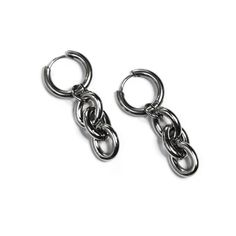 SIB Latch back stainless steel hoop earrings with polished cable chain dangles. These earrings are entirely stainless steel and will not tarnish. materials: stainless steel measurement: 15 mm diameter hoop Want to see more from SIB? >> Check out our website https://www.thesibshop.com >> Connect on Instagram - @sib.somewhereinbetween https://www.instagram.com/sib.somewhereinbetween/ >> Connect on Facebook https://www.facebook.com/SHOPSIB Silver Hoop Earrings For Streetwear, Silver Trendy Hoop Earrings For Streetwear, Grunge Punk Aesthetic, Jewelry Streetwear, Industrial Accessories, Alternative Streetwear, Punk Aesthetic, Alternative Jewelry, Grunge Punk