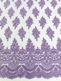 an image of purple lace on white fabric