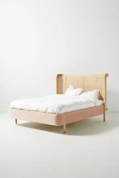 the bed is made up and ready for someone to use it in their home or office