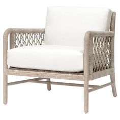 a white chair with wicker frame and cushion