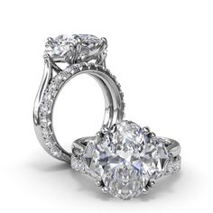 an oval cut diamond engagement ring set with side stones