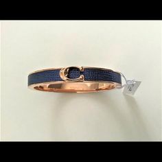 Brand New Coach Signature Push Hinged Bangle Bracelet *Sold Out Color* 100% Authentic Coach Rose Gold Signature "C" On Midnight Navy Blue Leather Midnight Navy Blue / Rose Gold Rose Gold Plated Brass Push Magnetic Hinged Closure Perfect For An Casual Day Out Or A Special Event Style F76634 Msrp $98 Adjustable Coach Bracelets For Parties, Coach Adjustable Jewelry For Party, Adjustable Coach Jewelry For Party, Chic Blue Jewelry For Formal Occasions, Chic Coach Bracelets For Gift, Chic Coach Bracelet, Formal Adjustable Coach Bracelets, Luxury Adjustable Bracelet By Coach, Chic Coach Bracelet Jewelry