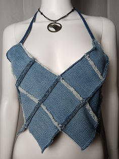 Retro cropped denim festival V-neck  halter with patchwork style, raw edges, pixie points and adjustable neck and waist ties.One Size1 of 1 Summer Cropped Top With Frayed Hem, Summer Cropped Crop Top With Frayed Hem, Summer Crop Top With Frayed Hem, Blue Denim Patchwork Top For Summer, Denim Blue Patchwork Tops For Summer, Summer Blue Patchwork Denim Top, Medium Wash Denim Top For Summer Festival, Denim Festival Crop Top, Trendy Summer Patchwork Crop Top